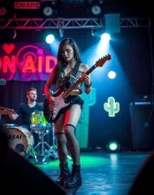 Vibrant Rocker on Stage in Leopard Print