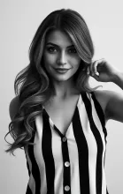Confident Striped Portrait with Wavy Hair