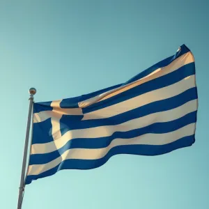 Vibrant Greek Flag Fluttering in Clear Sky: High-Quality HDR Photography