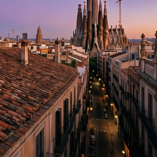 A view of Barcelona’s rooftops at dusk, capturing the contrast between the